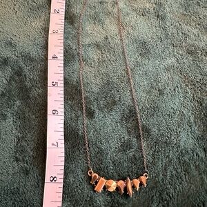 Elegant Gold Necklace with Geometric Charms